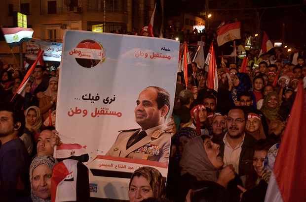 Thousands of Egyptians celebrated the 25th of January 2011 revolution anniversary at Al Etihadia Palace Square. Demonstrators chanted for the army and police and raised flags and banners bearing images of Gen. Abdel Fattah al-Sisi. (Photo: Adham Khorshed / Demotix)