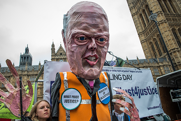 Activists marched with an effigy of justice minister Chris Grayling in March to protest legal aid cuts. (Photo: Velar Grant / Demotix)