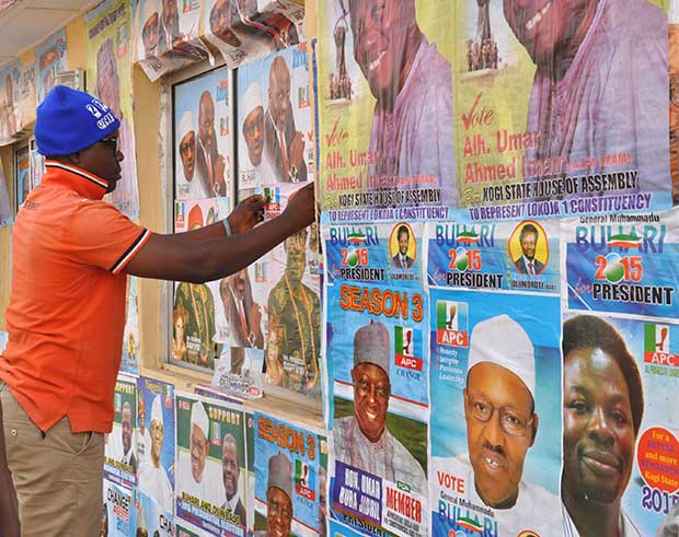 Walls are plastered with campaign posters ahead of the 14 Feb elections in Nigeria. (Heinrich-Böll-Stiftung/Flickr)