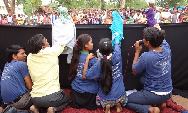 Volunteers put on a puppet show to teach rural people about the CGNet Swara project (Image: Purushottam Thakur)