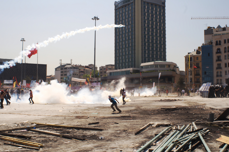 Riot police storm Taksim Square but protesters fight back