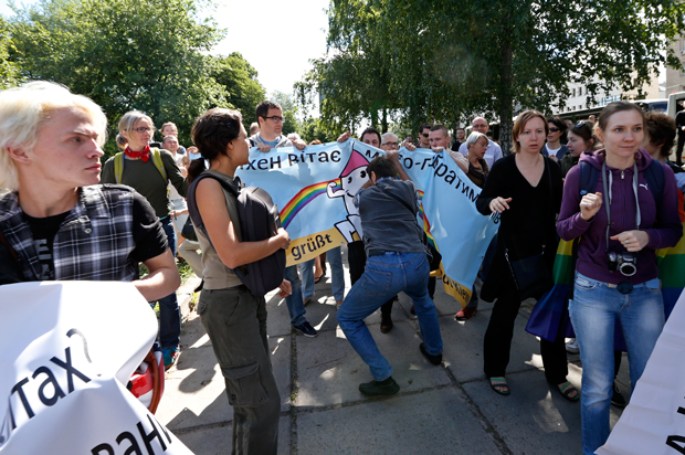 Opponents of the gay pride march attempted to disrupt by tearing down banners.