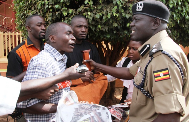 Police and protesters clash at the offices of the Daily Monitor, Kampala. Picture Isaac Kasamani/Demotix