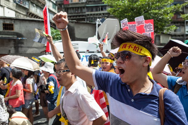 Activists and civic groups march in Taipei in protest against the Want Want China Times Group's planned acquisition of China Network Systems's cable TV services in Sept 2012. (Photo: Craig Ferguson / Demotix)