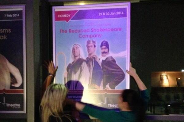 Staft at Newtownabbey's Theatre on the Mill return promotional posters to hoardings after the local council overturned a ban on the Reduced Shakespeare Company's The Bible (Abridged). Image Conor Macauley/Twitter