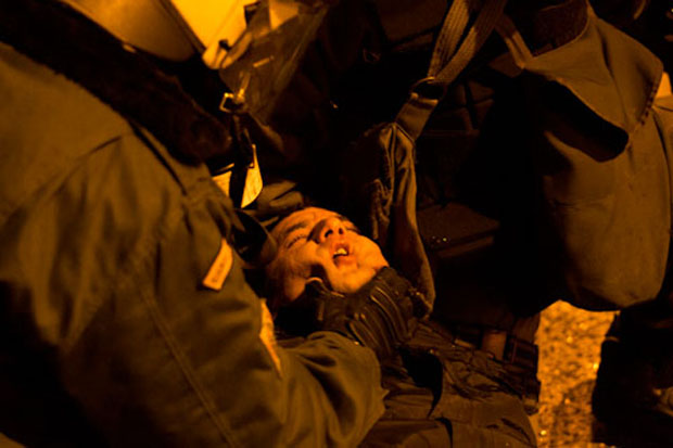 Unconscious protester dragged by police during an anti-fascist demonstration (Image: Nikolas Georgiou)