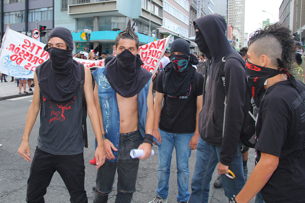 In Curitiba, about 300 protesters took to the streets of the central city asking for more health and safety improvements in the country and against the hosting of the World Cup 2014 in Brazil. (Image: João Frigério / Demotix)