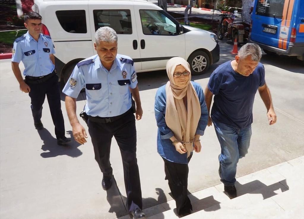 Büşra Erdal, mentioned in the text, surrendered in Manisa and taken to police hq in handcuffs. 