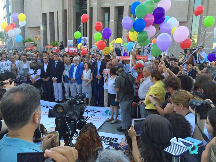 People gather in support of the Cumhuriyet defendants as the trial got underway.