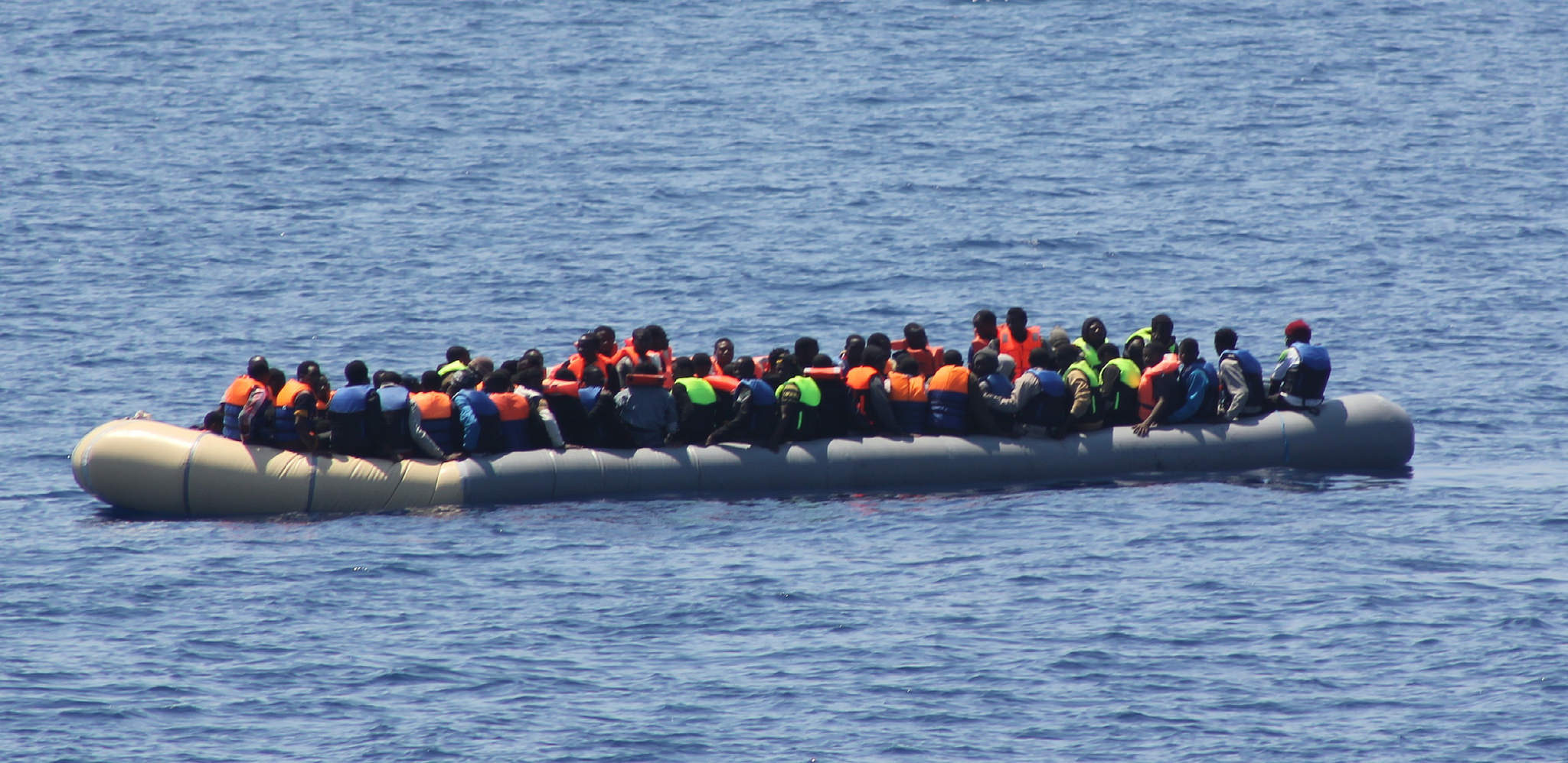 A number of Libyans attempting to flee the country in a rubber craft, in the sea north west of Tripoli, Irish Defence Forces/Flickr