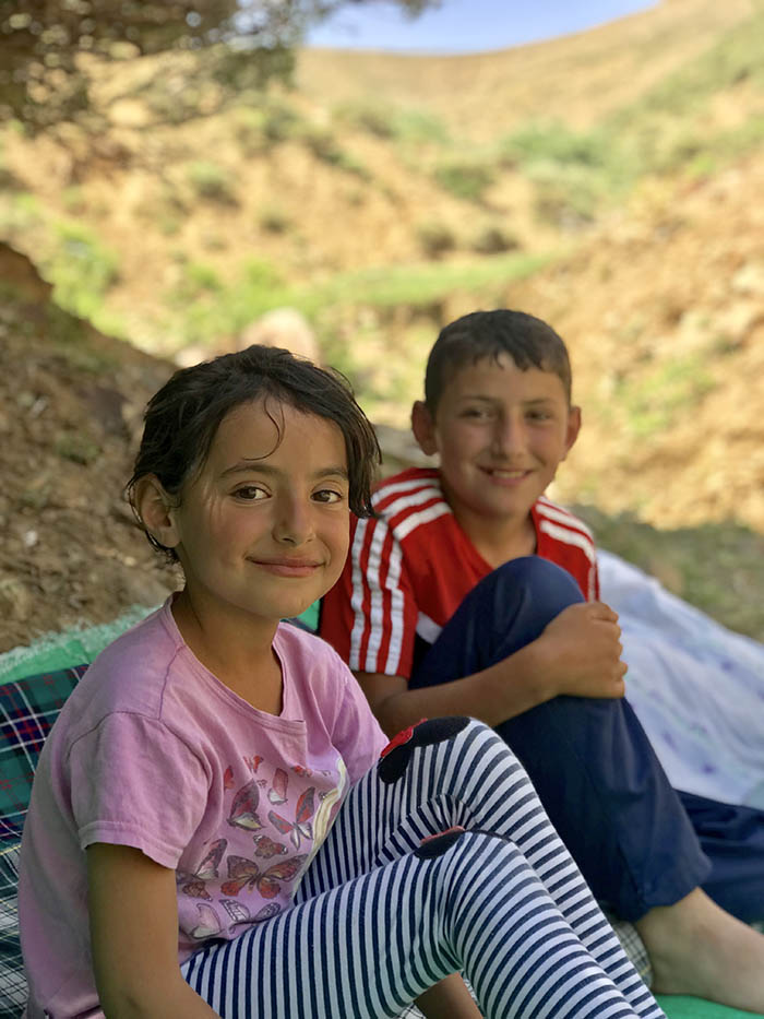 İdris Sayılgan’s eight-year-old sister Hivda and 12-year-old Yunus. The family guides the cattle to the pasture. (Credit: Mezopotamya Agency)