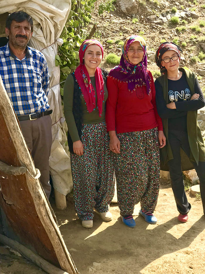 İdris Sayılgan’s father Ramazan, mother Sebiha and sisters Tuğba and İrem pose next to the tent where the family stays. (Credit: Mezopotamya Agency)