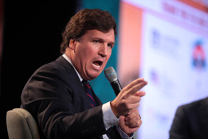 Tucker Carlson speaking with attendees at the Student Action Summit, hosted by Turning Point USA, at the Palm Beach County Convention Center in West Palm Beach, Florida, 22 December 2018. Credit: Gage Skidmore / Flickr