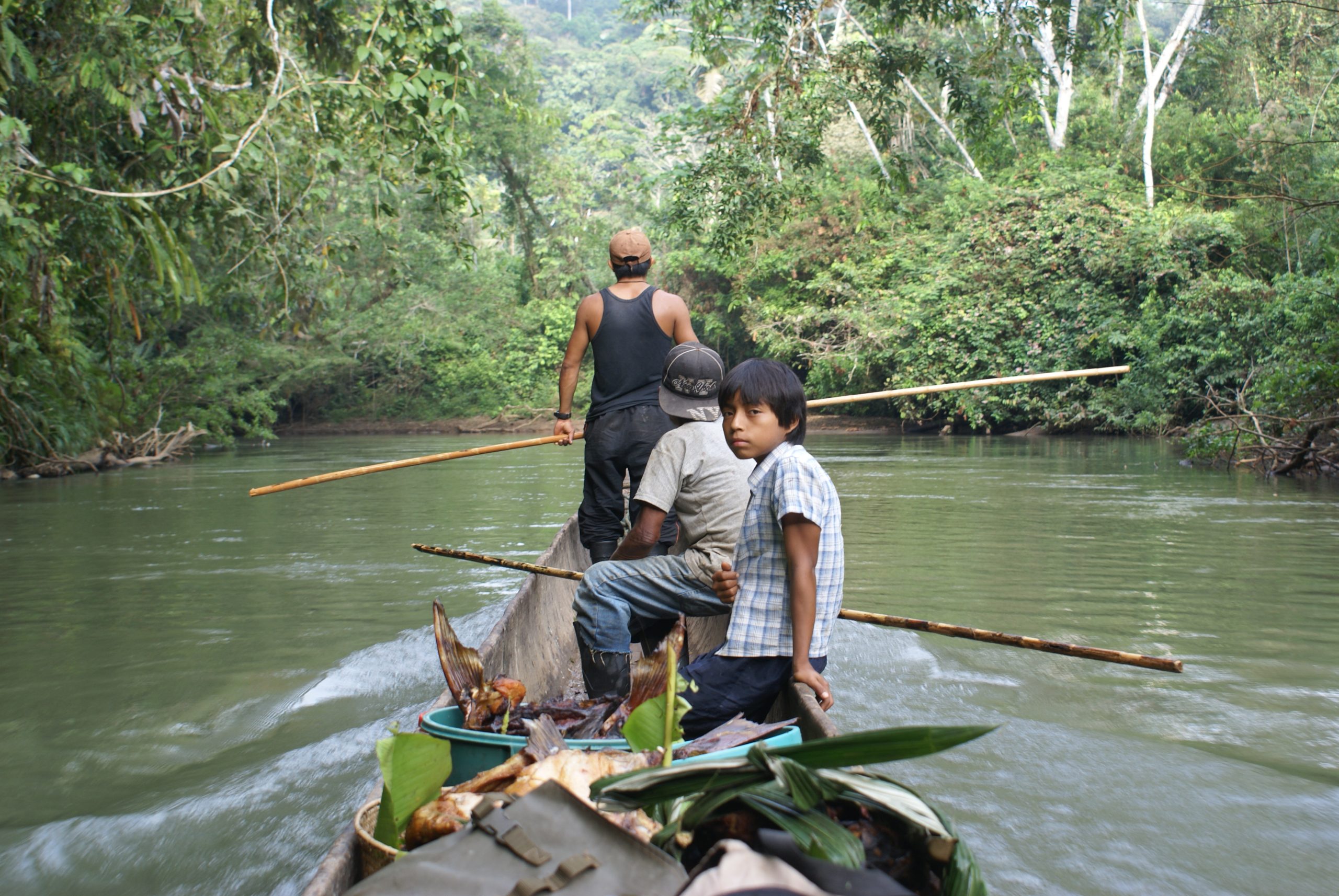 Sarayaku people on boat
