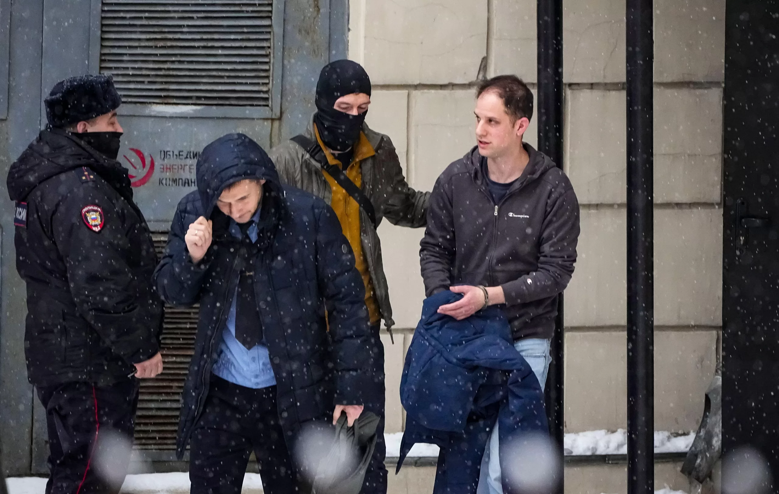 Not a criminal. Evan Gershkovich (right) is escorted from court in Moscow at the end of January after spending almost a year in jail despite having committed no crime. Credit: AP Photo/Alexander Zemlianichenko, File/Alamy