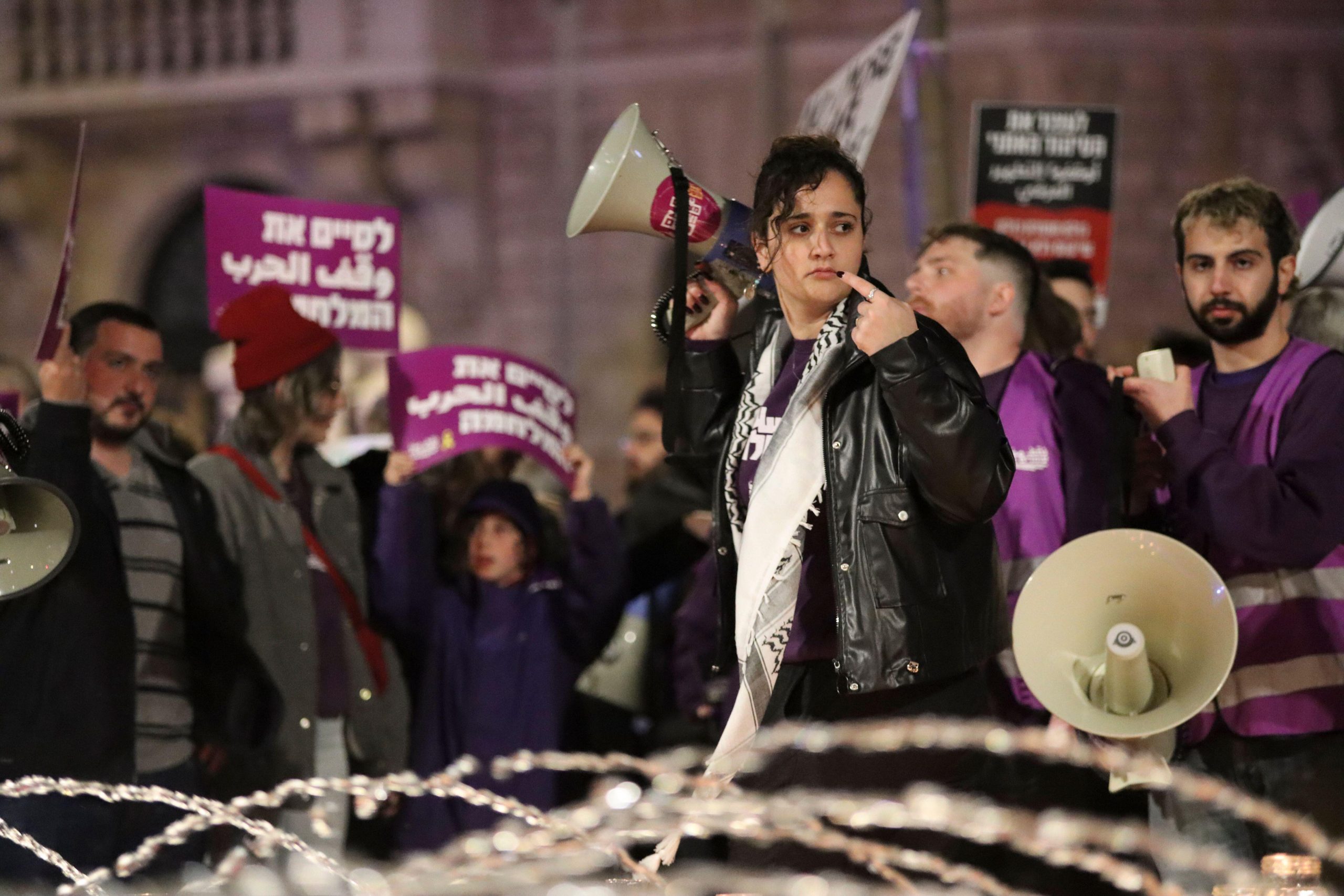 Protestors and activists led by the Jewish-Arab movement Standing Together demonstrate at Paris Square before marching to Zion Square in Jerusalem.