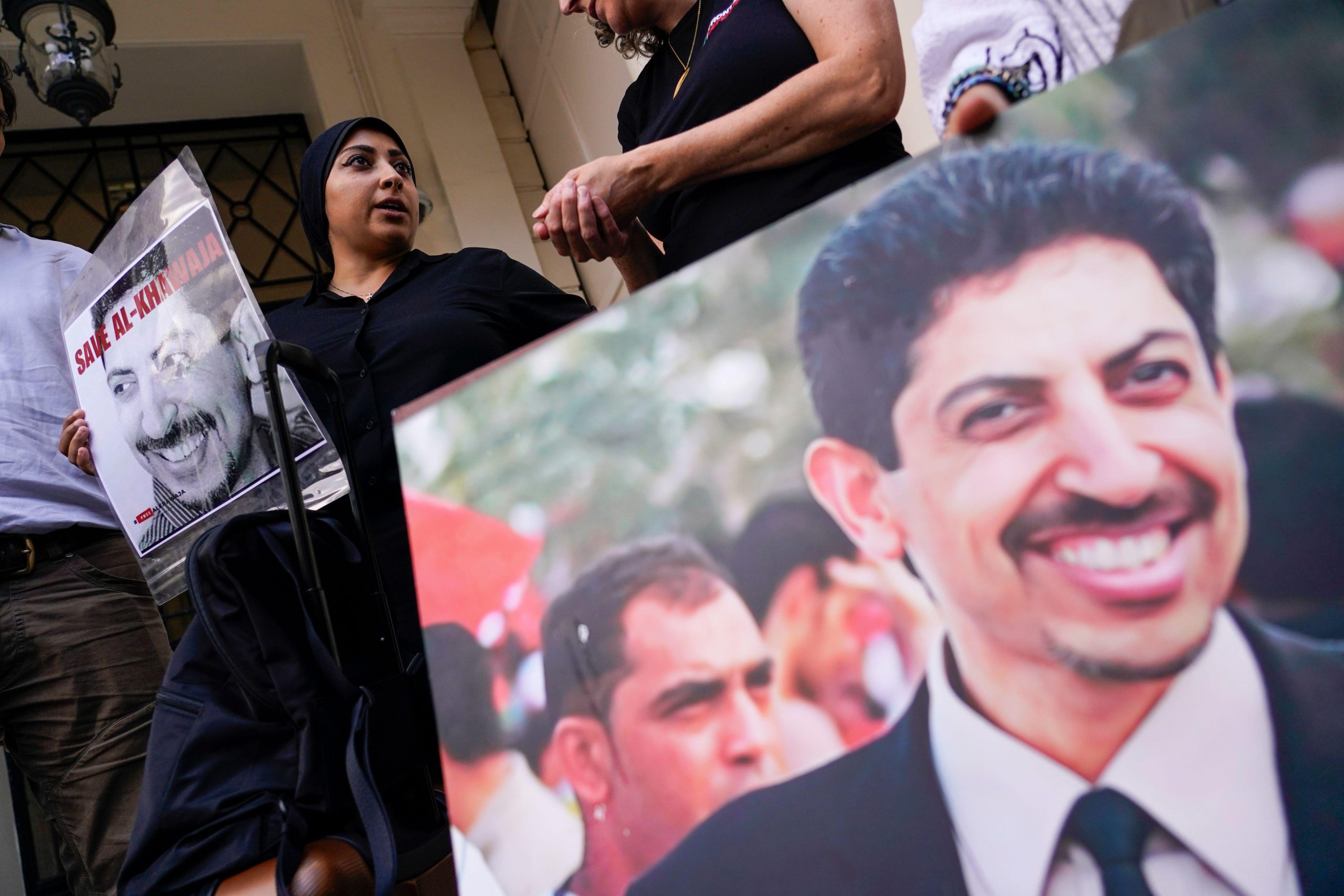 FILE – Maryam al-Khawaja holds a picture of her father, the imprisoned activist Abdulhadi al-Khawaja, outside the embassy of Bahrain in London, Sept. 15, 2023. (AP Photo/Alberto Pezzali, File)